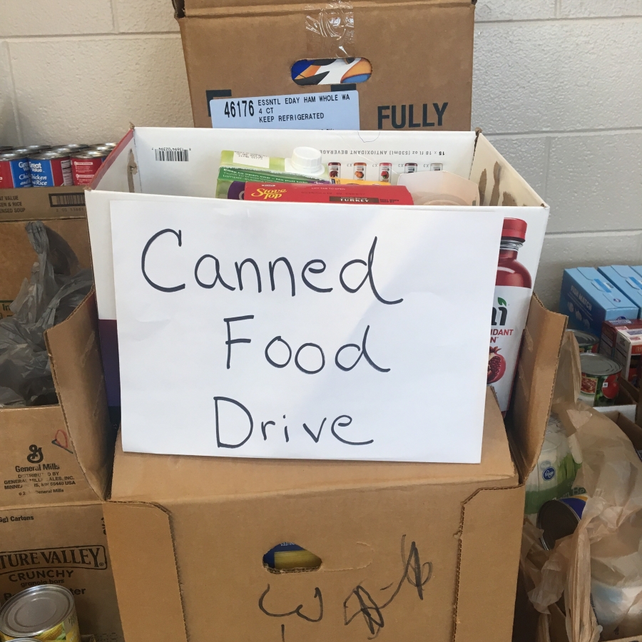 box with a canned food drive sign on it